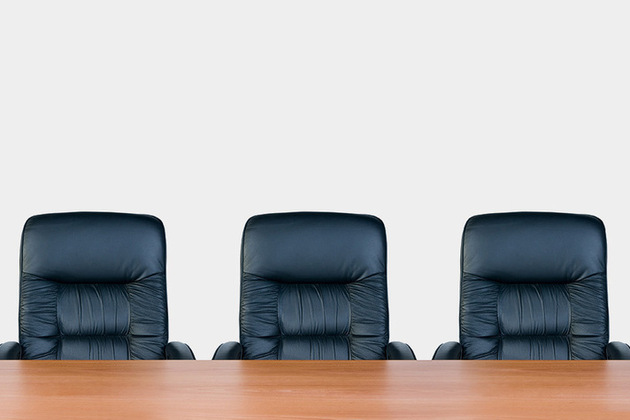 Image of three chairs behind a desk - image licensed by Ingram image