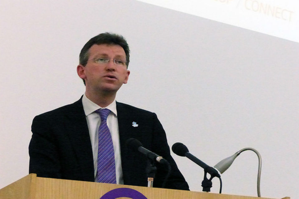 Photo of Attorney General delivering a speech at a conference