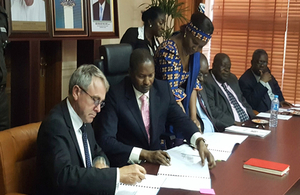 Immigration Minister signing agreement with Nigeria