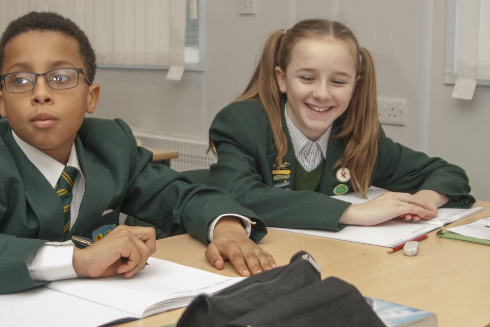Two pupils at desk