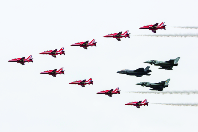 The Royal Air Force aerobatic team, The Red Arrows, performing a fly past in formation with the RAF F35B and a pair of Typhoons. Crown Copyright. Photo: via MOD.