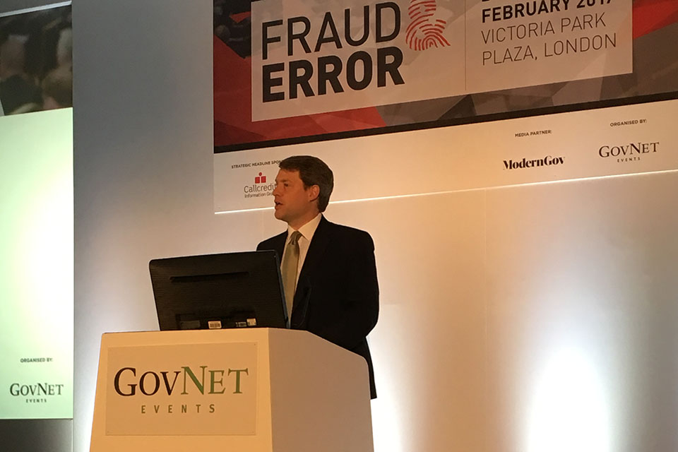 Chris Skidmore at the conference speaking from a lectern