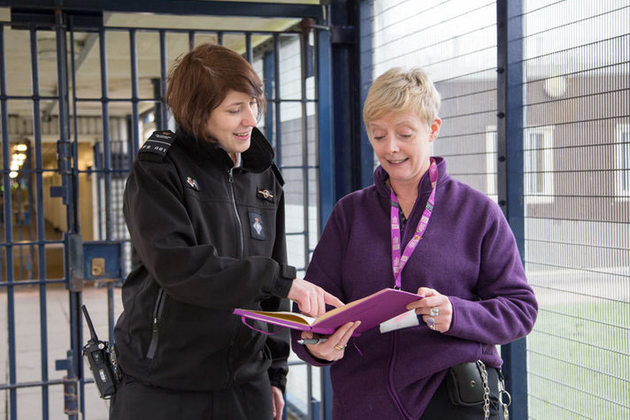 a prison officer and probation officer talking