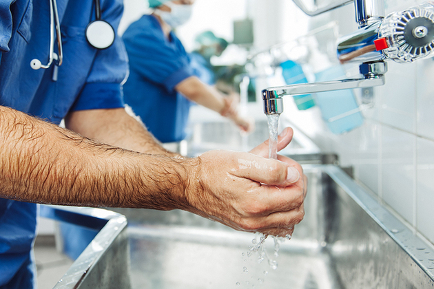 Surgeon washing hands