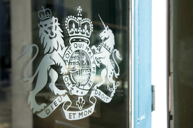 Image of HM Government sign on glass door