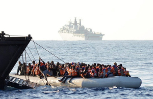 People are rescued from an inflatable boat by the Royal Navy in the Mediterranean, June 2017.