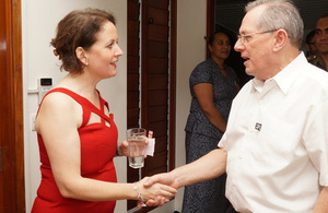 High Commissioner Melanie Hopkins greets Acting President and Chief Justice, Hon Justice Anthony Gates
