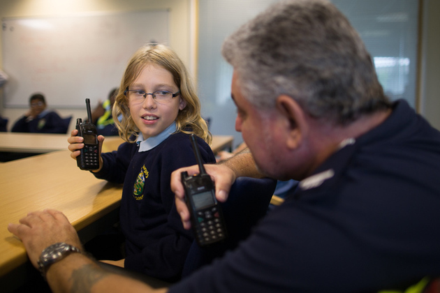 image of operations manager explaining the workings of the team to St Werburgh’s schoolchildren