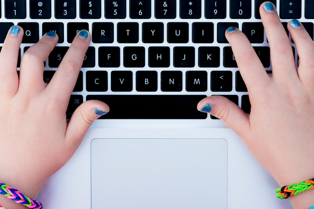 young person using computer keyboard