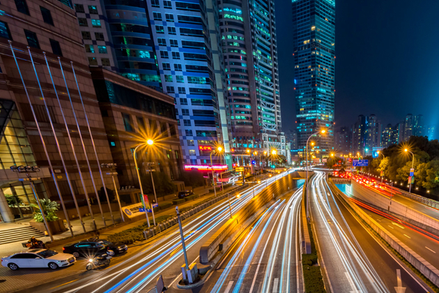 Blurred lights from traffic on a road.