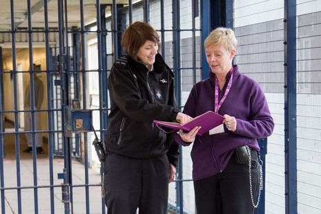a prison officer and a probation officer working together