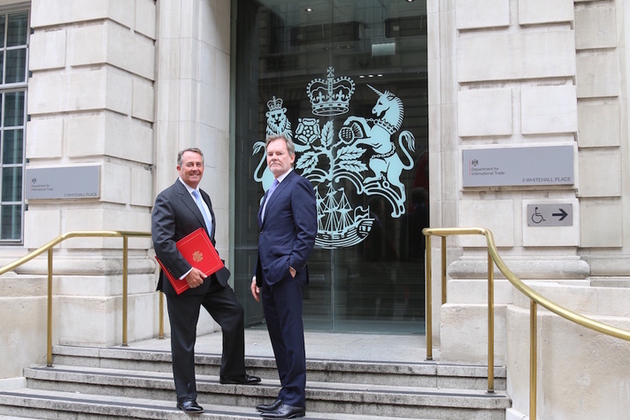 Picture of Dr Liam Fox welcoming Crawford Falconer outside the Department for International Trade