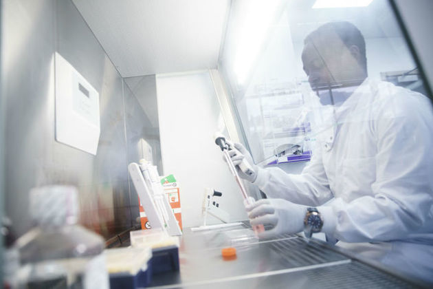 Autolus Operations Assistant Precious Koto works at the laboratory in London