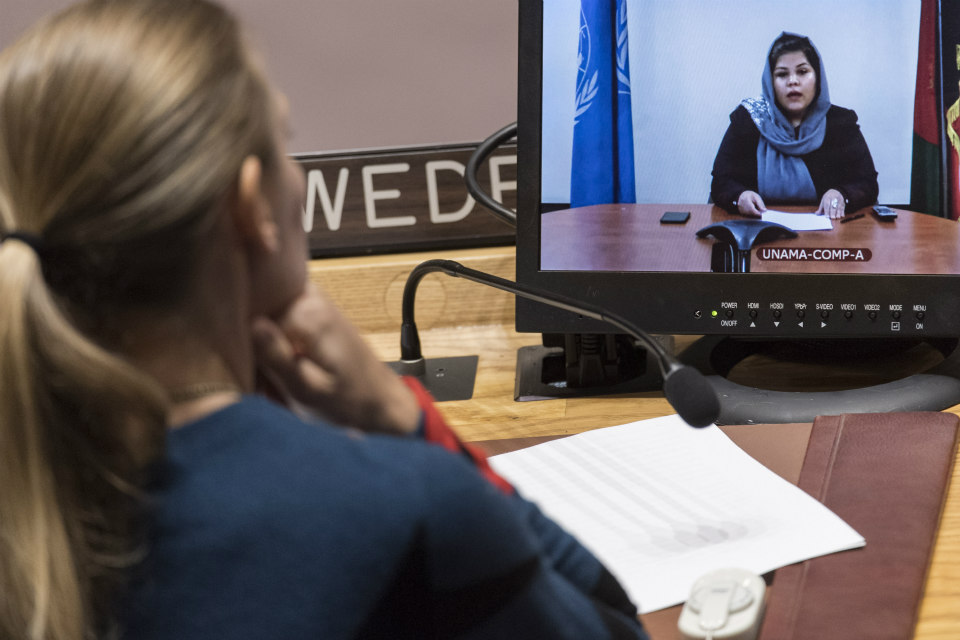 Wazhma Frogh (shown on screen), Founding member of Women and Peace Studies Organization, addresses the Security Council on the situation in Afghanistan and it’s implications for international peace and security. (UN Photo/Mark Garten)