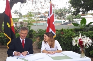 Ambassador John Dennis and Filipa Lima signing the project contract for business arbitration in Angola