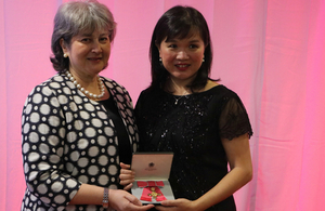 Professor Teo Soo-Hwang recieveing her Order of the British Empire OBE