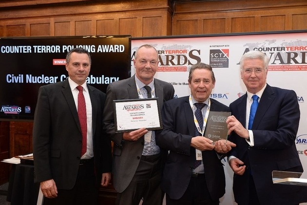 Supt Bell and Eugene Johnson receive the award on behalf of the CNC