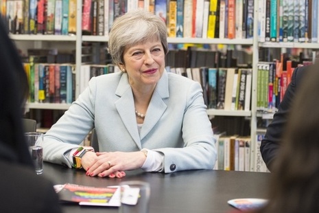 Prime Minister Theresa May in conversation with unseen participants