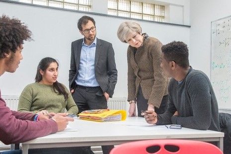Prime Minister Theresa May talking to a group of young people