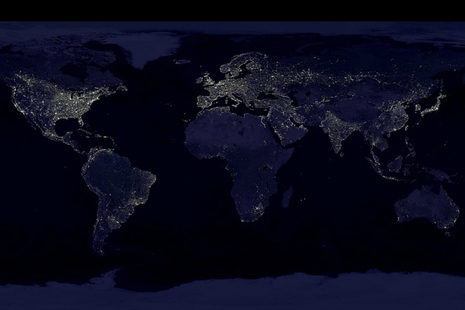 Composite image showing a global view of Earth at night, compiled from over 400 satellite images (credit: NASA/NOAA).