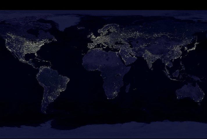 Composite image showing a global view of Earth at night, compiled from over 400 satellite images (credit: NASA/NOAA).