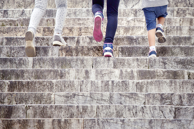 Children walking up stairs