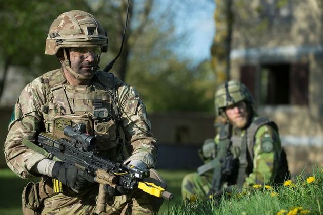 Image shows British and Swedish soldiers working with each other rehearsing for the Joint Expeditionary Force Demonstration as part of Exercise Joint Warrior in Copehill Down, Salisbury Plain Training Area.