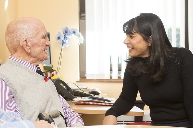 Elderly gentleman talking to doctor