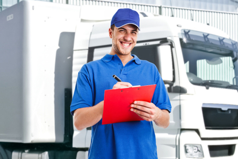 photo of transport manager stood near a vehicle