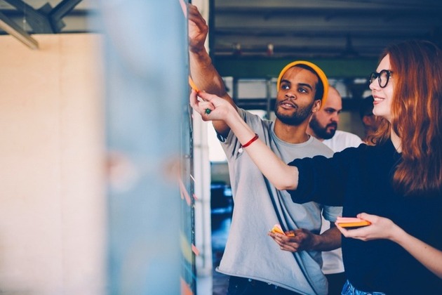Colleagues work together in a creative brainstorm