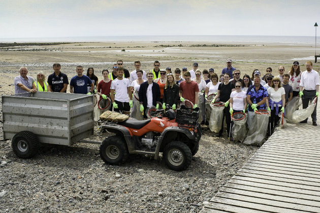 Volunteers picking up litter on Seascale beach.