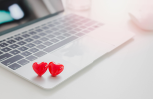 image of two hearts on top of a laptop