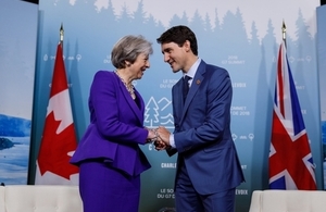 PM May with PM Trudeau Shaking Hands