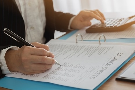 Lady looking at balance sheet