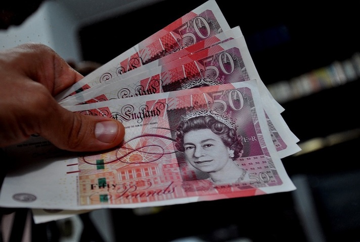 Image of a person handing over money