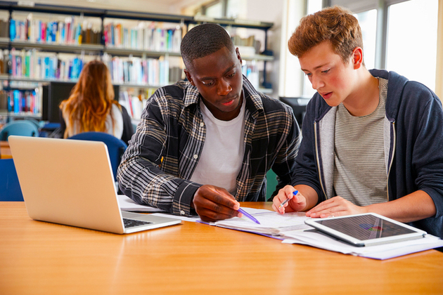 College students look at university application.