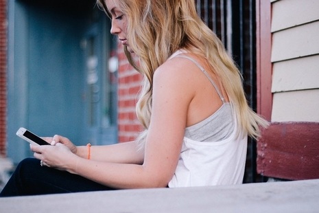 Teenage girl looking at phone