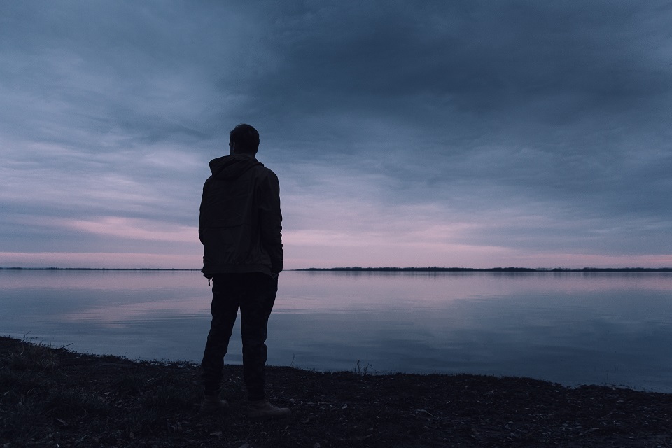 Image of young man standing alone