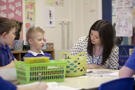 Female teacher marking.