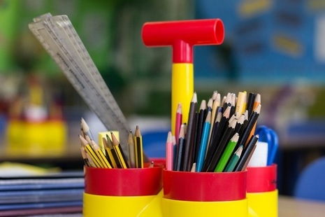 Colourful pencils and pens in pen holder