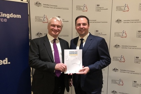 Graham Stuart and Steven Ciobo hold a copy of the UK-Australia investment report.