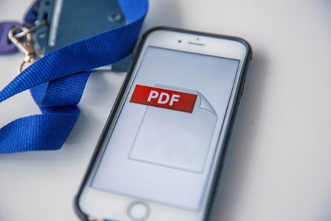 A mobile phone with a PDF logo on the screen