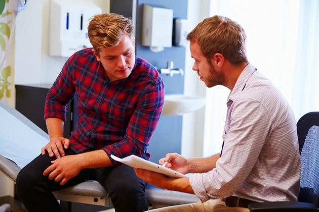 Male patient speaks with a doctor