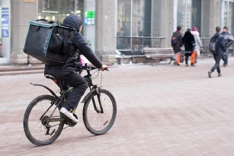 Man on a bike delivering food