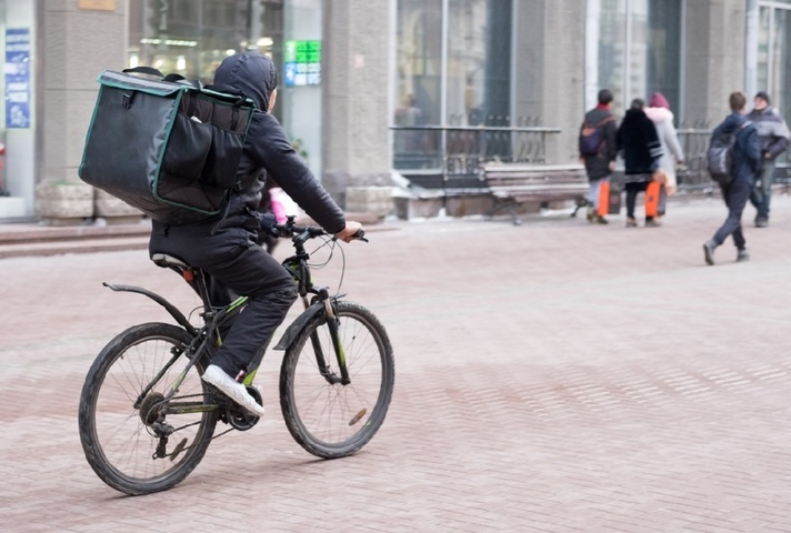 Man on a bike delivering food