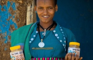 A beekeeper with honey for sale in Ethiopia's Amhara region. Credit: Bees for Development
