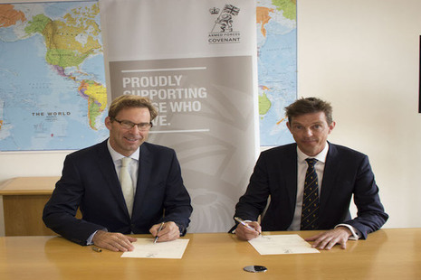 Defence Minister Tobias Ellwood and TechVets co-founder Mark Milton sign the Armed Forces Covenant.