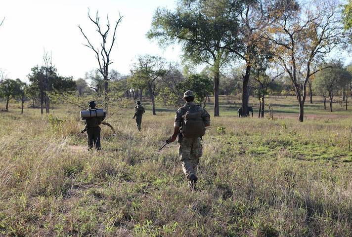 Local park rangers and UK soldiers patrol Nkhotakota and Majete Wildlife Reserves in Malawi to combat poaching.