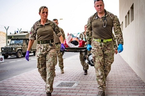 Members of the Joint Medical Group use a stretcher to carry a simulated casualty.