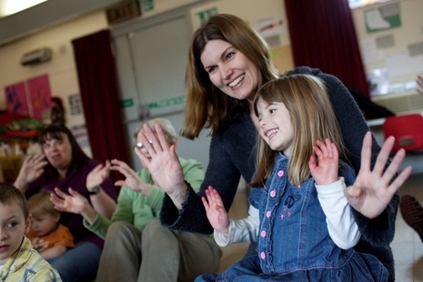 Early years practitioner with children